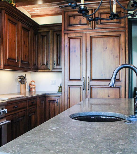 dark custom cabinetry in an updated kitchen